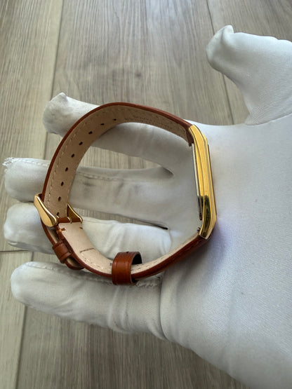 Bulova rectangular dress watch, gold-tone case on a leather strap, quartz movement